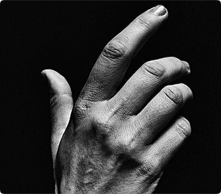 A hand gesture representing observation